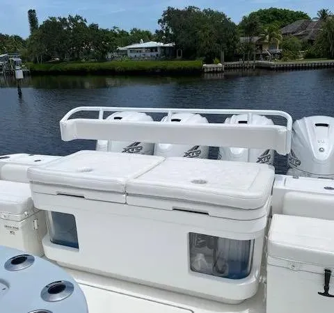 Slide: The Image of 2019 HCB 53 Sueños boat with multiple outboard engines on a calm waterway. - 4