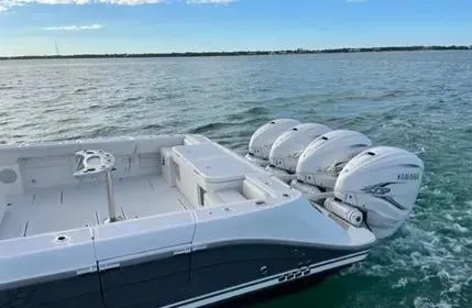 Slide: The Image of 2019 HCB 53 Sueños boat with four Yamaha outboard engines on open water. - 6