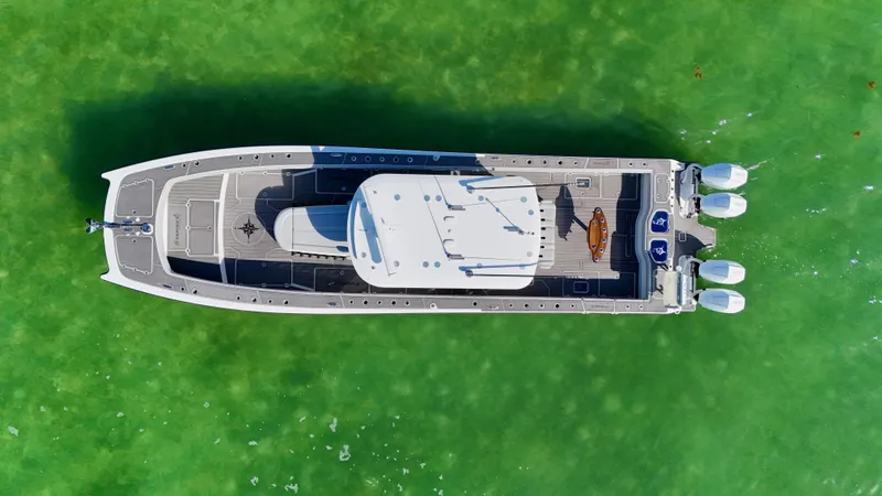 Slide: The Image of Aerial view of 2021 Freeman 47 boat on vibrant green water. - 10
