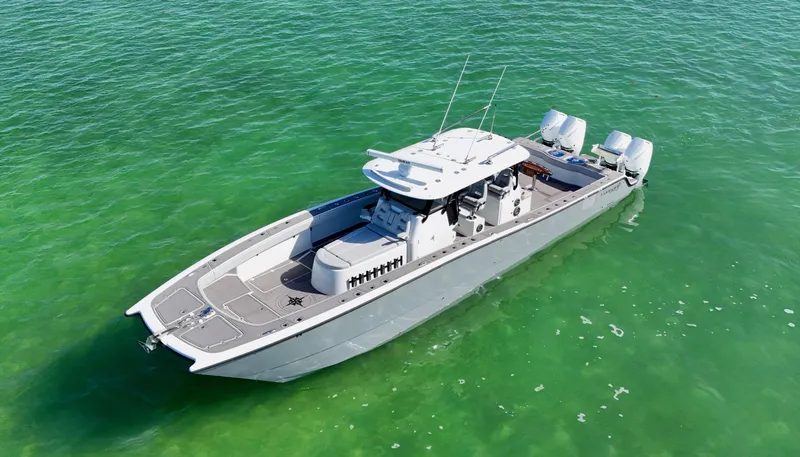 Slide: The Image of 2021 Freeman 47 boat on clear green water, aerial view. - 12