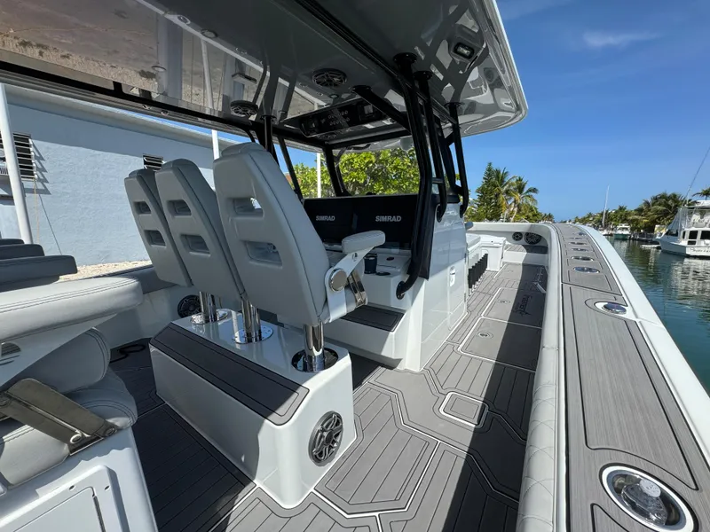 Slide: The Image of Luxury Freeman 47 boat interior, 2021 model, featuring sleek seating and advanced navigation equipment. - 19