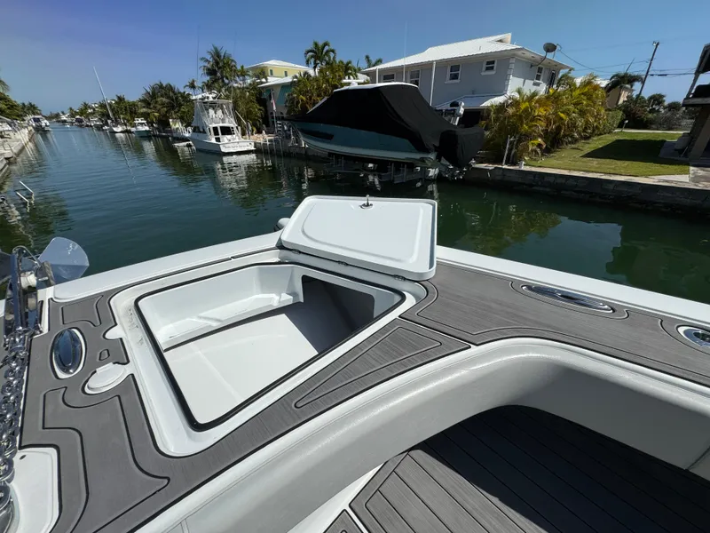 Slide: The Image of Open hatch on Freeman 47 boat, docked in a scenic canal, 2021 model. - 27