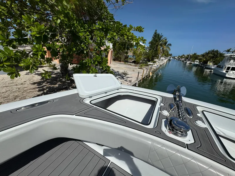 Slide: The Image of Open hatch on Freeman 47 boat, docked by a scenic canal, 2021 model. - 28