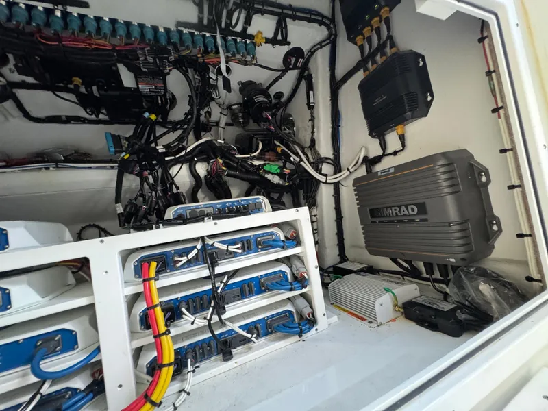 Slide: The Image of Electrical system inside a 2021 Freeman 47 boat, featuring Simrad equipment and organized wiring. - 34