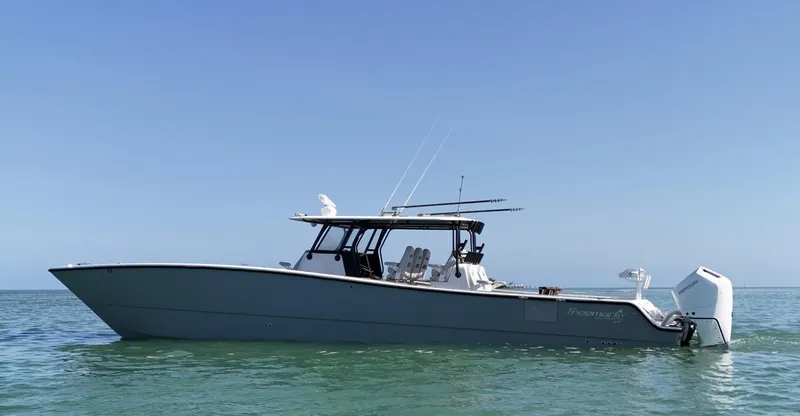 Slide: The Image of 2021 Freeman 47 boat on calm sea under clear blue sky. - 5