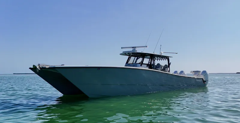 Slide: The Image of 2021 Freeman 47 boat on calm water under clear blue sky. - 6
