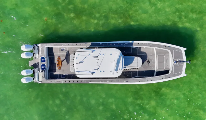 Slide: The Image of Aerial view of 2021 Freeman 47 boat on vibrant green water. - 8