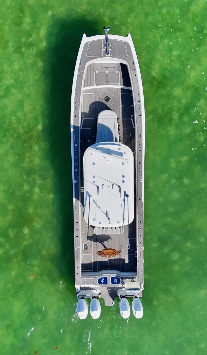 Slide: The Image of Aerial view of 2021 Freeman 47 boat on vibrant green water. - 9