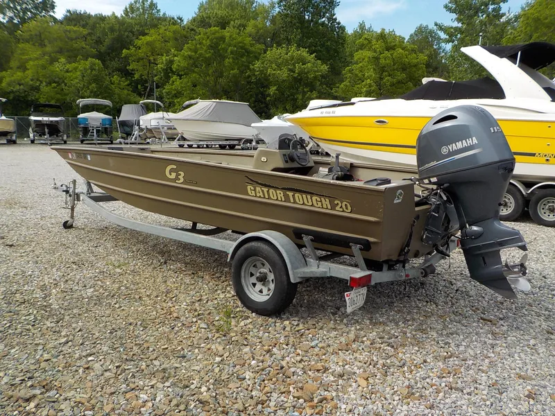Slide: The Image of 2021 G3 20 SC boat with Yamaha motor on trailer, parked on gravel lot. - 1