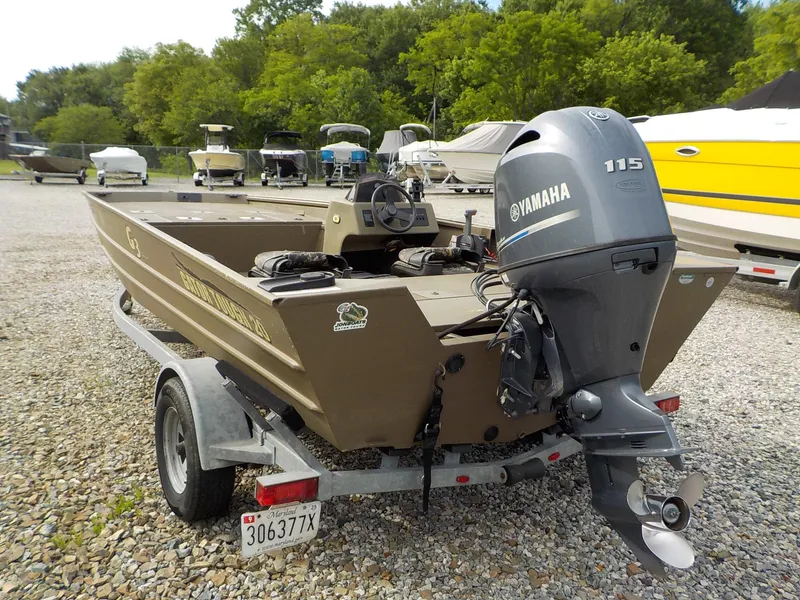 Slide: The Image of 2021 G3 20 SC boat with Yamaha 115 engine on a trailer in a boatyard. - 12