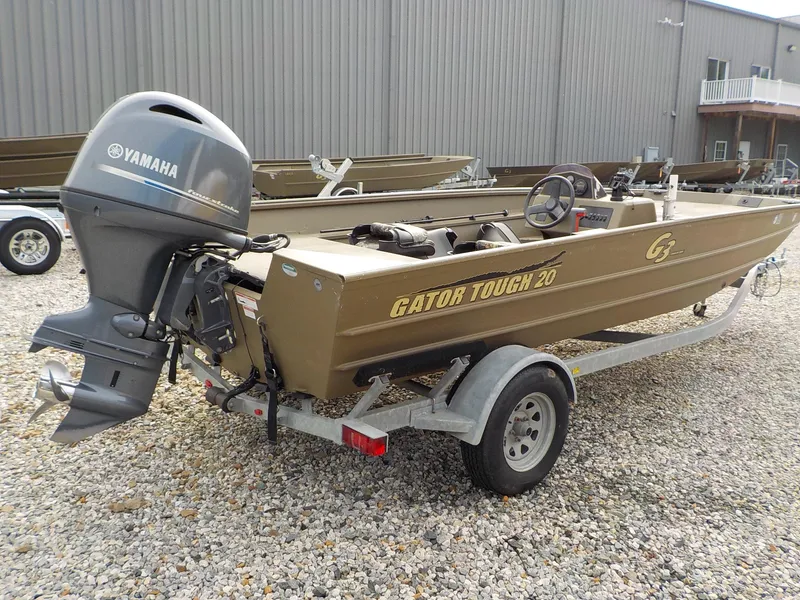 Slide: The Image of 2021 G3 20 SC boat with Yamaha motor on a trailer, parked on gravel. - 14