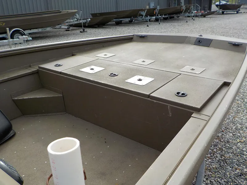 Slide: The Image of 2021 G3 20 SC boat interior with storage compartments and seating area. - 6