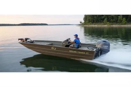 Slide: The Image of 2021 G3 20 SC boat cruising on a calm lake with a Yamaha engine. - 9