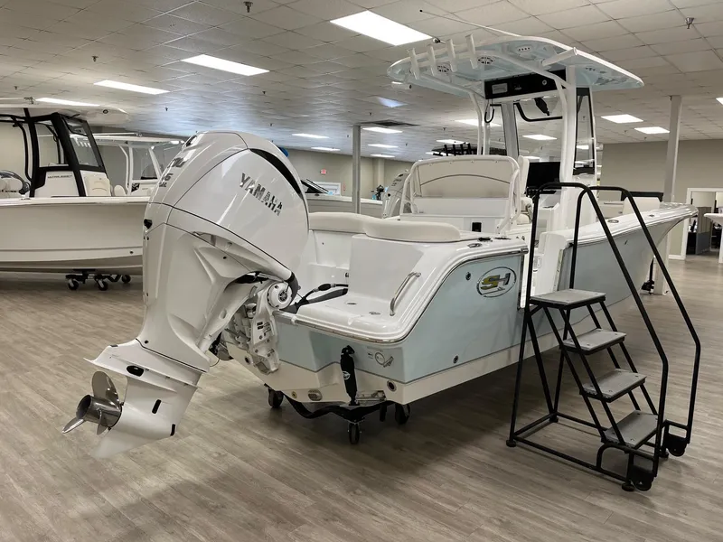 Slide: The Image of 2025 Sea Hunt Ultra 245 SE boat with Yamaha outboard engine in showroom. - 3