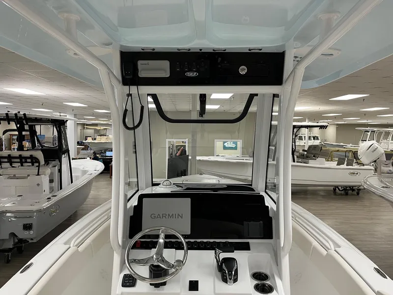 Slide: The Image of 2025 Sea Hunt Ultra 245 SE boat interior with Garmin navigation system. - 6