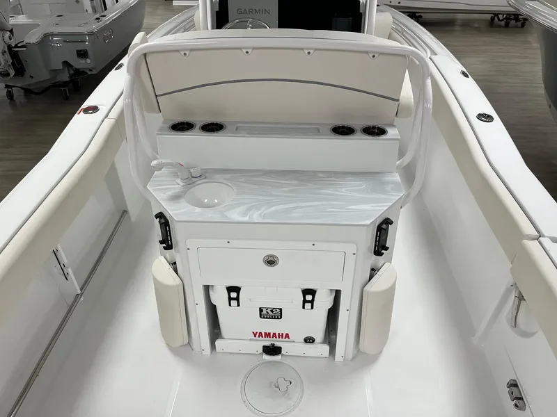 Slide: The Image of 2025 Sea Hunt Ultra 245 SE boat interior with Yamaha cooler and sink. - 9