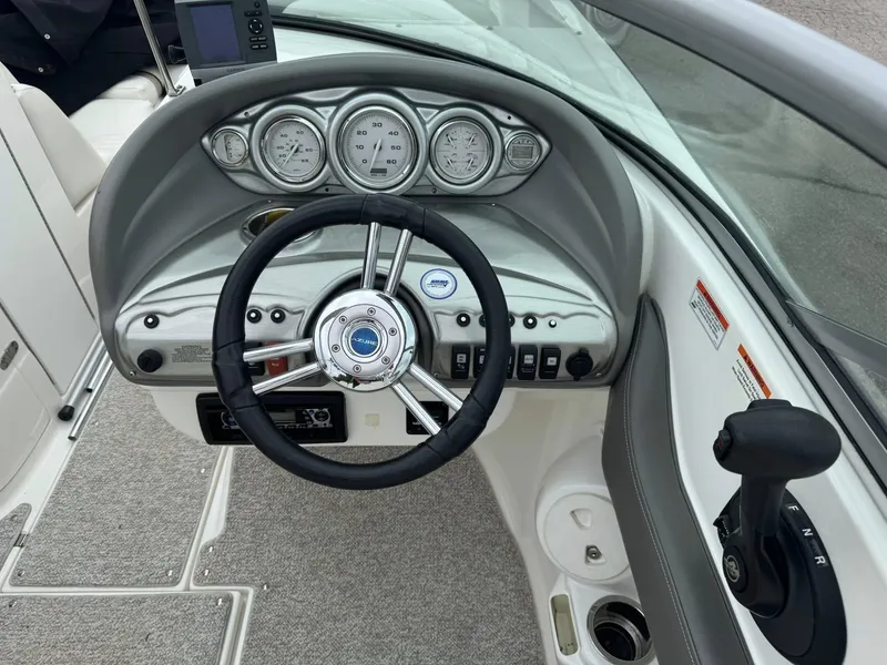 Slide: The Image of Steering console of a 2012 Azure AZ298 boat with gauges and controls. - 20