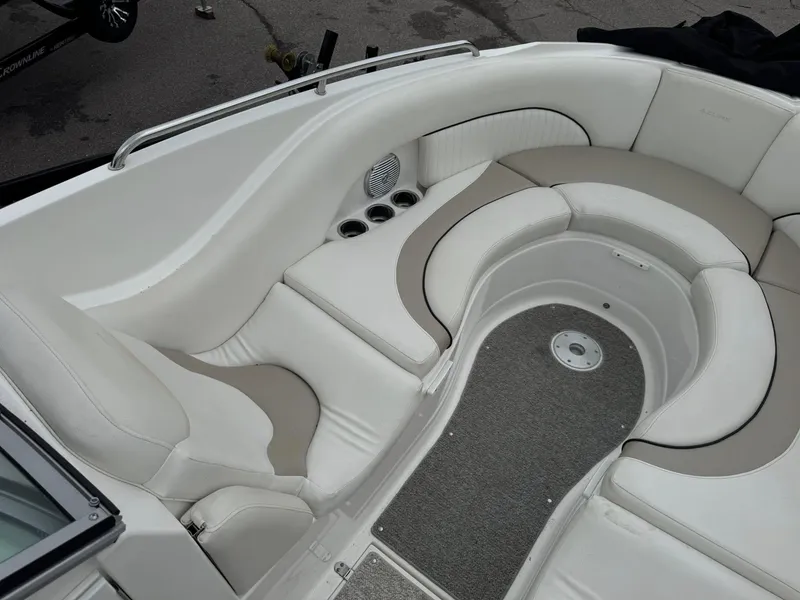 Slide: The Image of Luxurious seating area on a 2012 Azure AZ298 boat with cup holders and carpeted flooring. - 21
