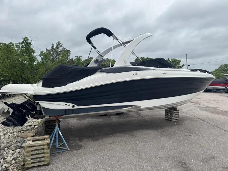 Slide: The Image of 2012 Azure AZ298 boat on stands, covered, outdoors, cloudy sky. - 24
