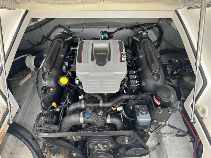 Slide: The Image of Engine compartment of a 2012 Azure AZ298 boat, featuring a 377 MAG engine. - 29