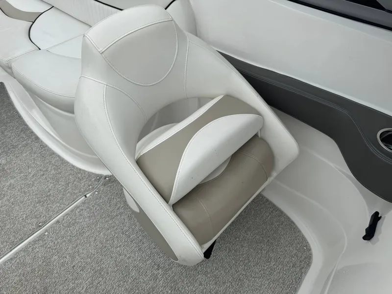Slide: The Image of White and beige boat seat in a 2012 Azure AZ298, featuring sleek design and comfortable upholstery. - 5