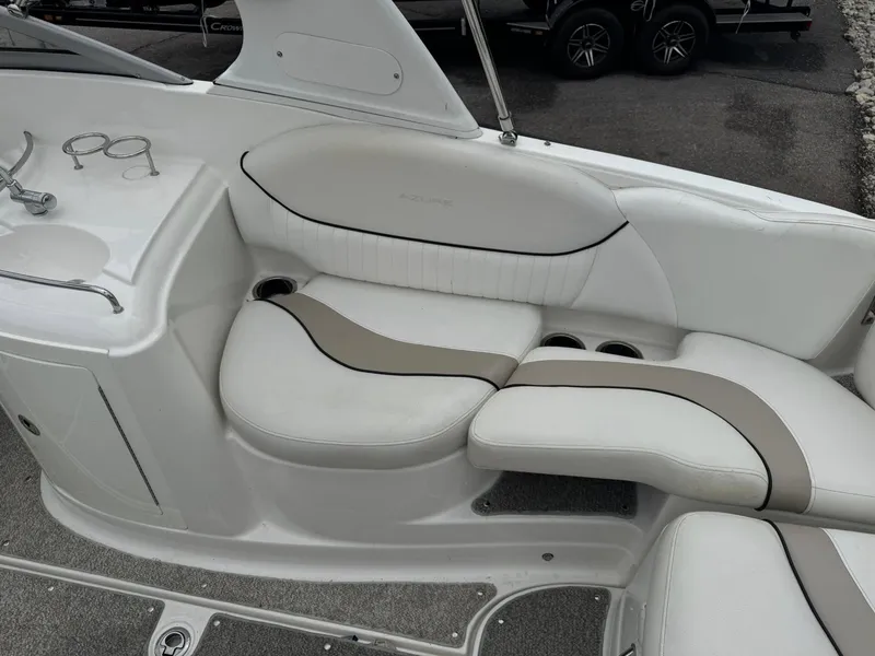 Slide: The Image of Luxury seating on a 2012 Azure AZ298 boat, featuring white and beige upholstery. - 6