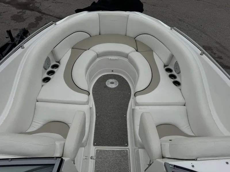 Slide: The Image of 2012 Azure AZ298 boat interior with white cushioned seating and cup holders. - 7