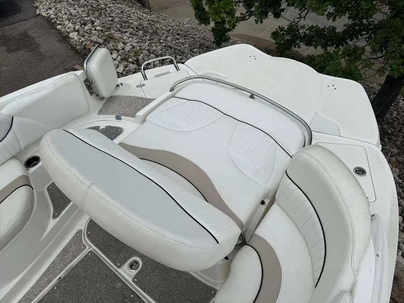 Slide: The Image of White seating area on a 2012 Azure AZ298 boat, surrounded by rocky terrain. - 9