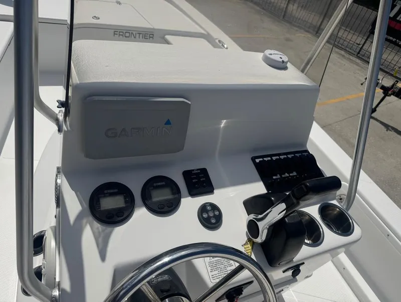 Slide: The Image of Control panel of a 2018 Frontier 2104 boat with Garmin electronics. - 14