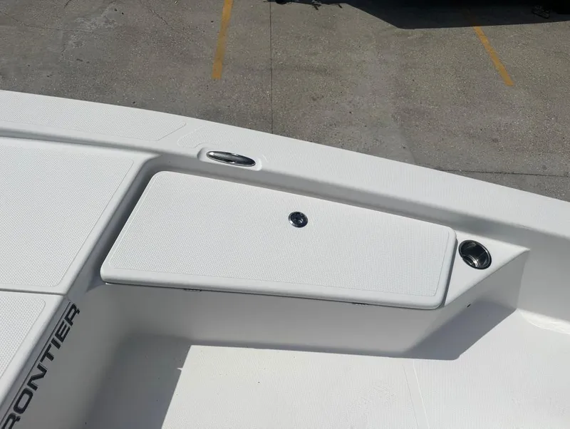 Slide: The Image of Frontier 2104 boat deck, 2018 model, featuring storage compartment and sleek design. - 17
