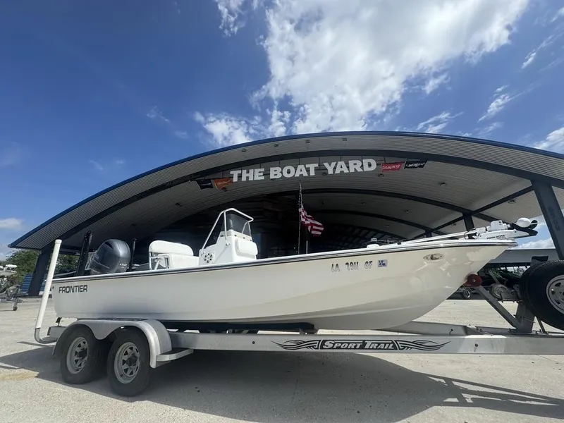 Slide: The Image of 2018 Frontier 2104 boat on trailer at The Boat Yard under clear sky. - 4
