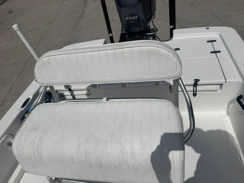 Slide: The Image of White seating on a 2018 Frontier 2104 boat with Yamaha 150 engine. - 7