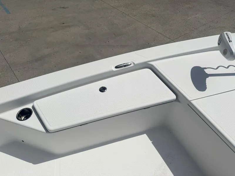 Slide: The Image of Frontier 2104 boat deck, 2018 model, featuring storage compartment and cup holder. - 8