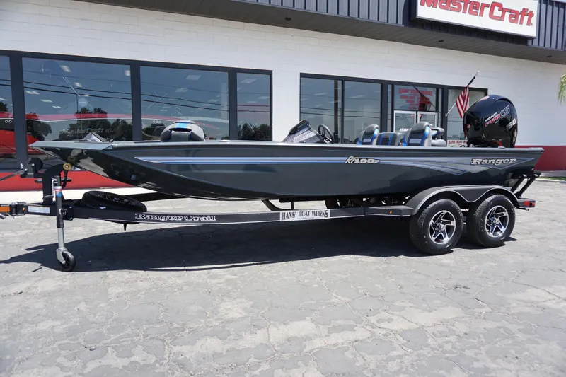 Slide: The Image of 2025 Ranger RT198P boat on trailer outside MasterCraft dealership. - 12