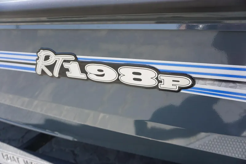 Slide: The Image of 2025 Ranger RT198P boat logo with blue and white stripes. - 13