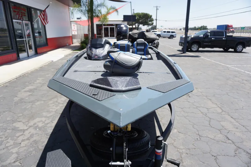 Slide: The Image of 2025 Ranger RT198P boat parked outside dealership, showcasing sleek design and modern features. - 16