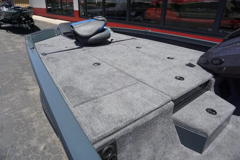 Slide: The Image of 2025 Ranger RT198P boat deck with gray carpet and seating. - 3
