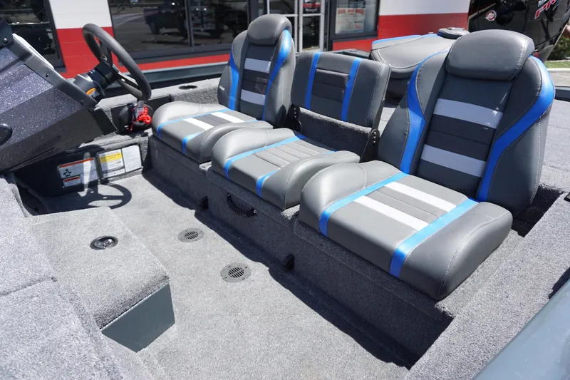 Slide: The Image of 2025 Ranger RT198P boat interior with gray and blue seating. - 4