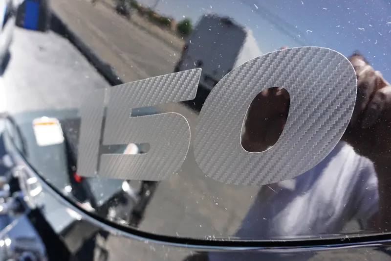 Slide: The Image of Close-up of '150' decal on 2025 Ranger RT198P boat exterior. - 6