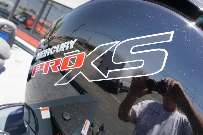 Slide: The Image of Mercury Pro XS engine on 2025 Ranger RT198P boat, reflecting surroundings. - 7