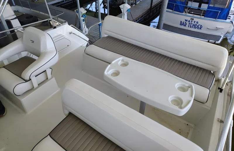 Slide: The Image of 1992 Carver Command Bridge 28 boat interior with seating and table. - 12