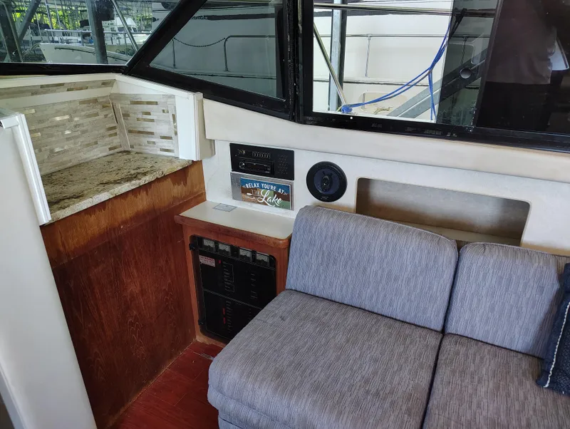 Slide: The Image of Interior of 1992 Carver Command Bridge 28 with seating and control panel. - 19