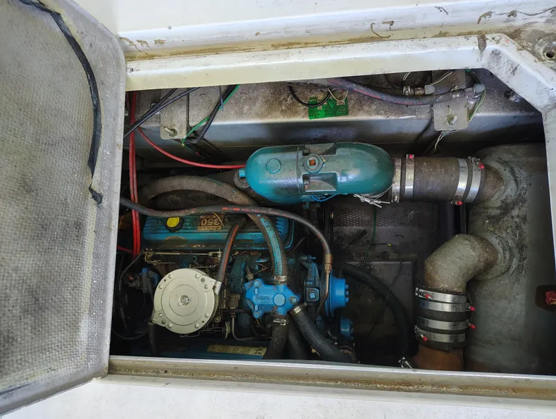 Slide: The Image of Engine compartment of a 1992 Carver Command Bridge 28 boat, showing mechanical components. - 31