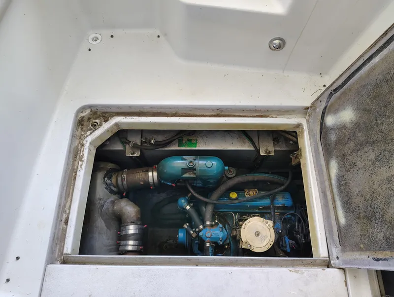 Slide: The Image of Engine compartment of a 1992 Carver Command Bridge 28, showcasing mechanical components. - 32