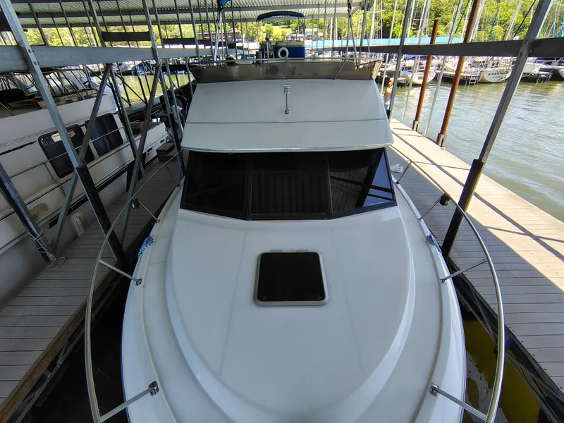 Slide: The Image of 1992 Carver Command Bridge 28 docked in a marina, top view. - 9