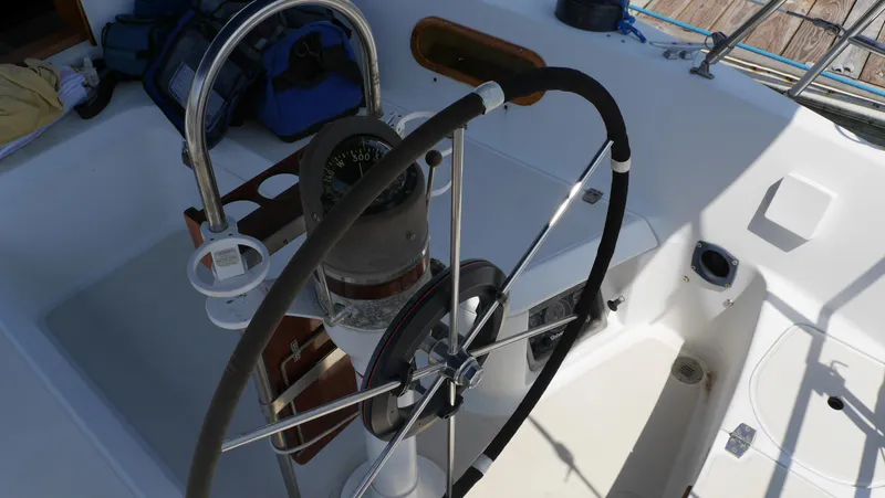 Slide: The Image of Steering wheel and compass of 1986 Ericson 35 MKIII sailboat cockpit. - 15