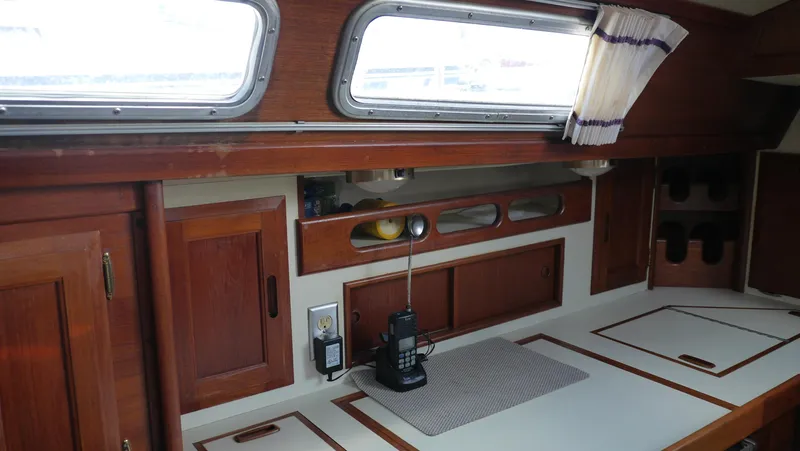Slide: The Image of Interior of 1986 Ericson 35 MKIII sailboat with wooden cabinetry and countertop. - 22