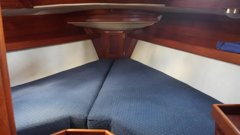 Slide: The Image of Interior cabin of 1986 Ericson 35 MKIII sailboat with blue bedding. - 26