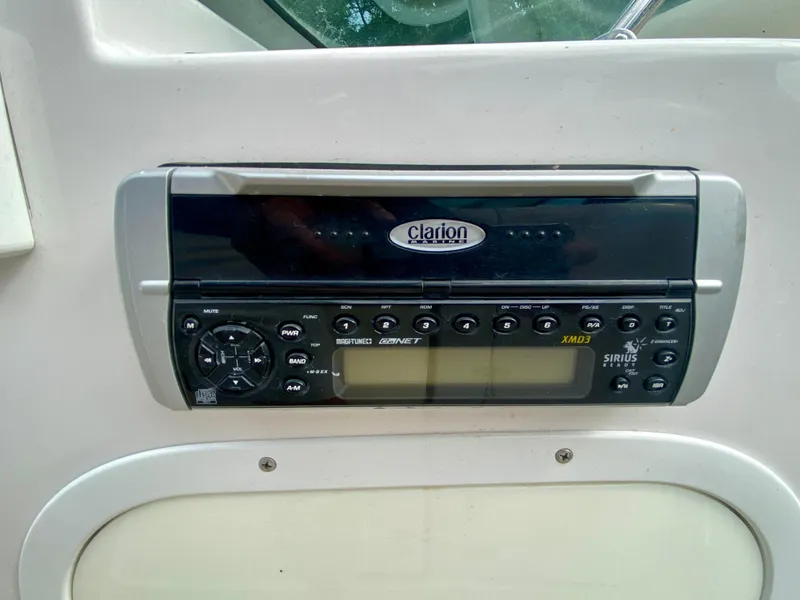Slide: The Image of Clarion stereo system on 2005 Four Winns 234 Funship boat dashboard. - 11
