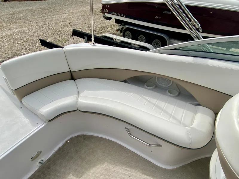 Slide: The Image of 2005 Four Winns 234 Funship boat interior with white cushioned seating. - 13